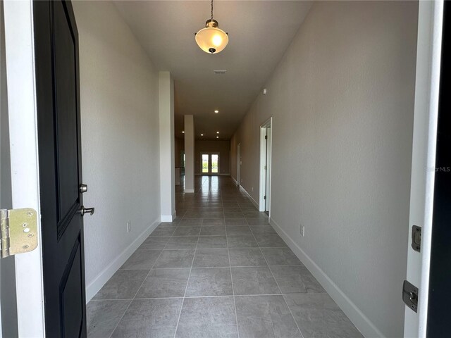 4445 SW 90th Pl, Ocala, FL 34476 - corridor with light tile patterned floors and baseboards