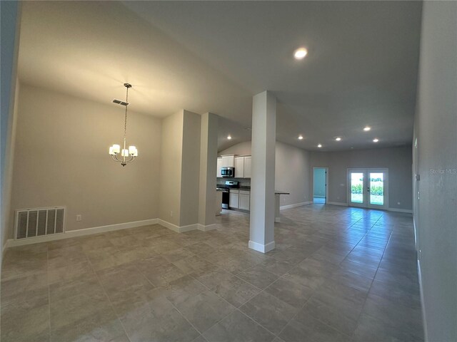 4445 SW 90th Pl, Ocala, FL 34476 - spare room featuring a chandelier, recessed lighting, vaulted ceiling, baseboards, and light tile patterned floors