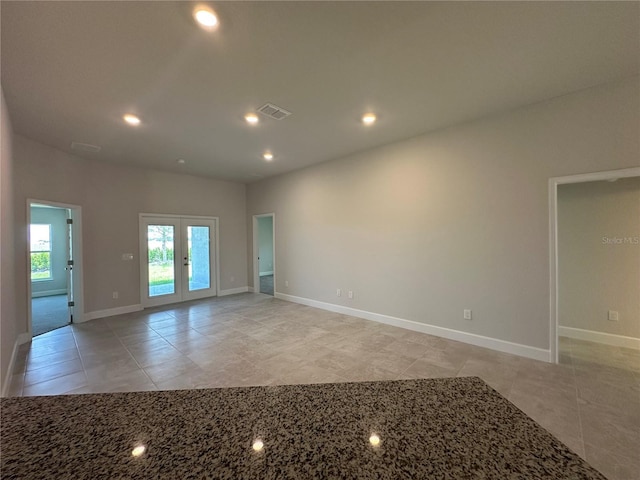 4445 SW 90th Pl, Ocala, FL 34476 - empty room with french doors, light tile patterned floors, baseboards, and recessed lighting