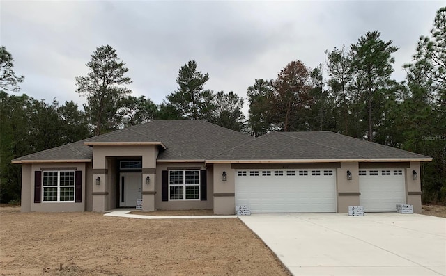 prairie-style house featuring a garage