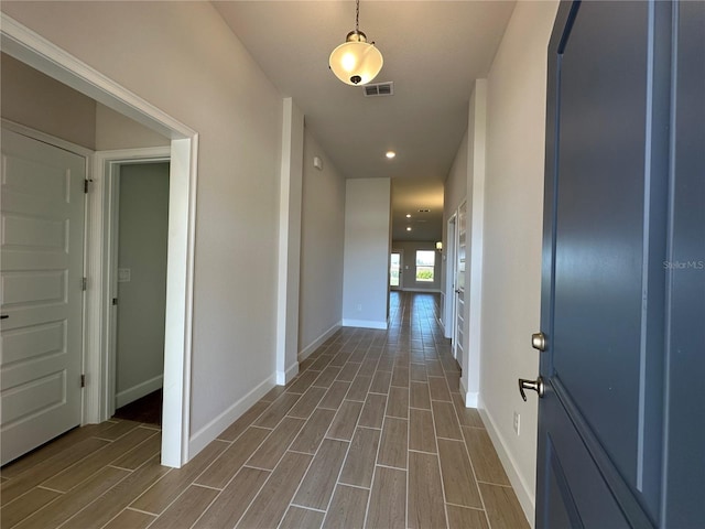 hallway featuring dark hardwood / wood-style flooring