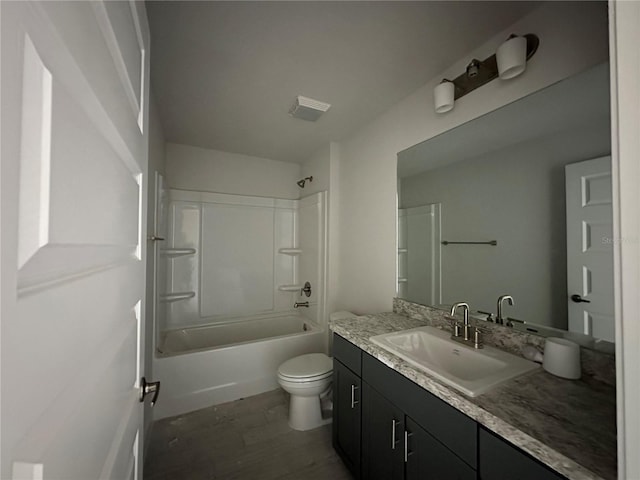 full bathroom featuring vanity, toilet, wood-type flooring, and shower / washtub combination