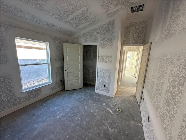 unfurnished bedroom with vaulted ceiling