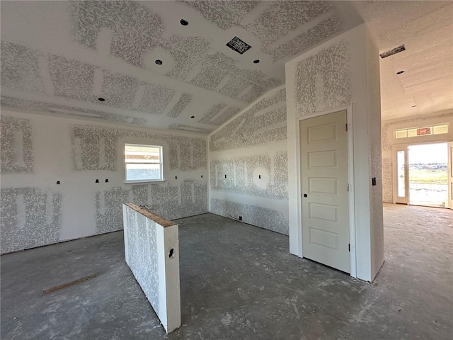 kitchen with plenty of natural light and lofted ceiling