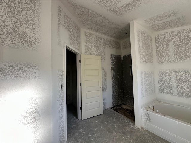 bathroom with separate shower and tub and concrete floors