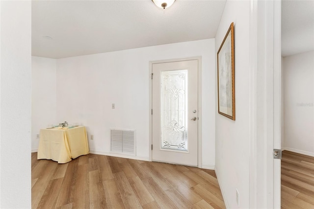 doorway to outside with light hardwood / wood-style floors