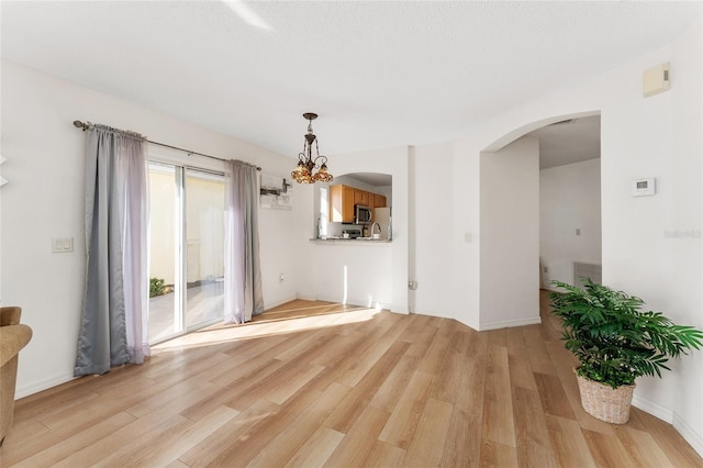 spare room with light hardwood / wood-style flooring