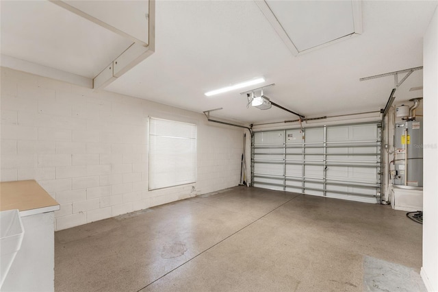 garage featuring water heater and a garage door opener