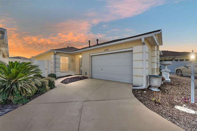 ranch-style house featuring a garage