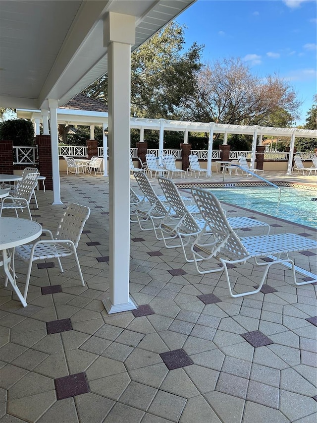 view of patio / terrace featuring a community pool