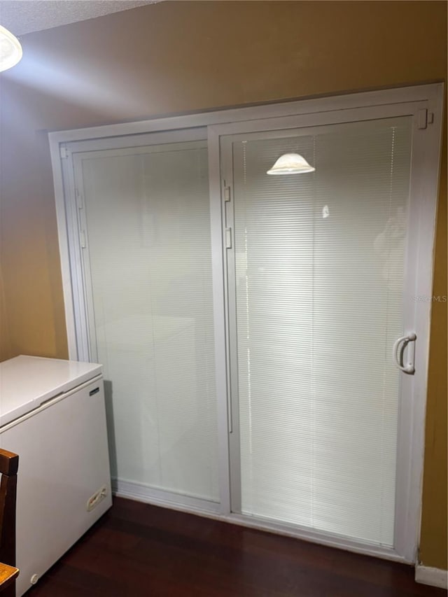 bathroom with hardwood / wood-style floors