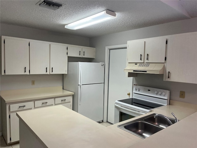 kitchen featuring white cabinetry, sink, a textured ceiling, white appliances, and light tile patterned floors