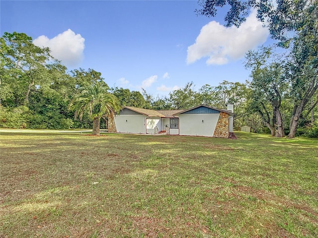 exterior space with a front lawn