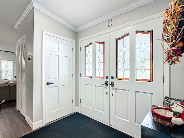 entryway with crown molding and dark hardwood / wood-style floors