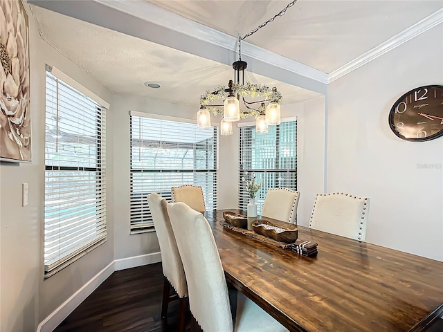 dining area featuring a notable chandelier, dark hardwood / wood-style flooring, and ornamental molding