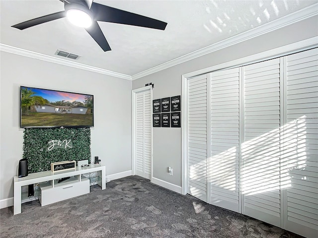 living room with ceiling fan, ornamental molding, and dark colored carpet