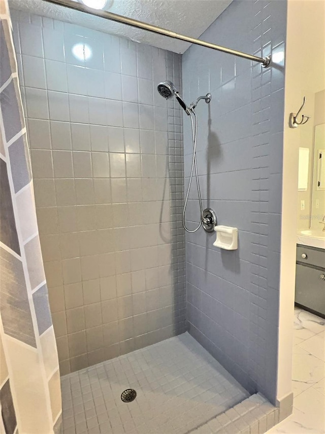 bathroom with vanity and curtained shower