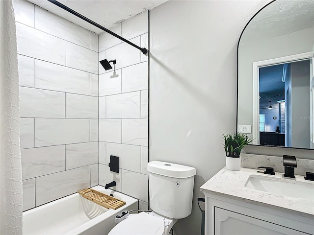 full bathroom featuring shower / bath combo, vanity, and toilet