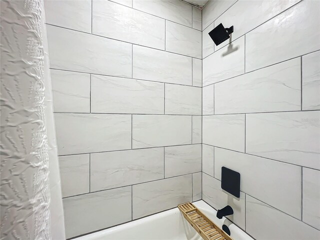 bathroom featuring shower / tub combo with curtain