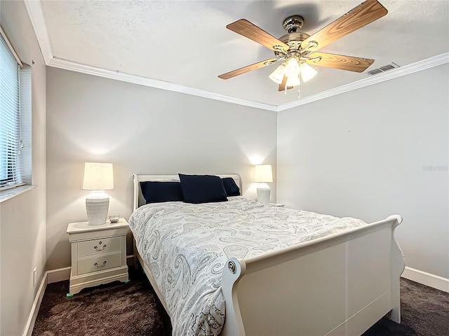 bedroom featuring dark carpet, ceiling fan, and crown molding