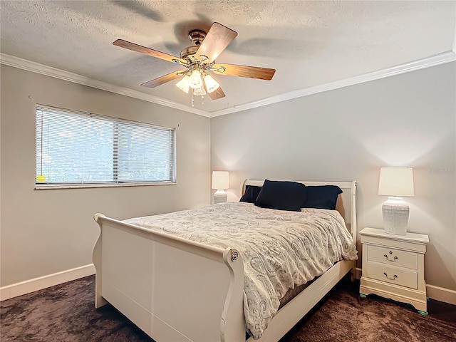 bedroom with ceiling fan, dark carpet, a textured ceiling, and ornamental molding