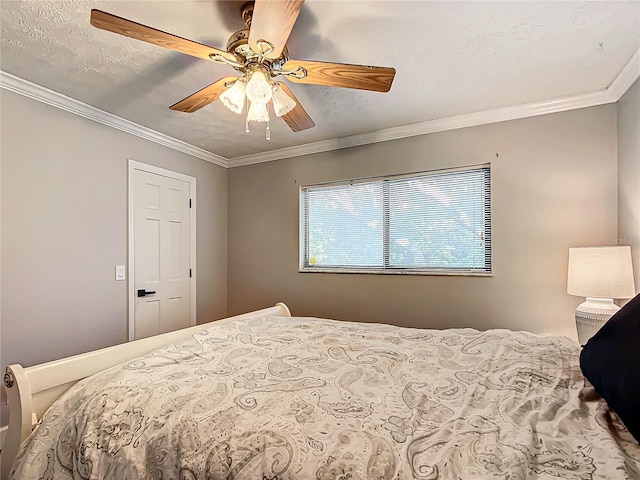 bedroom featuring a textured ceiling, ceiling fan, and ornamental molding