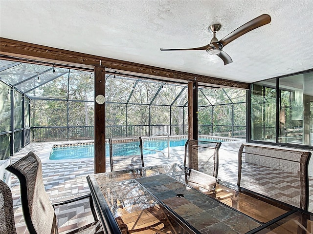 view of pool with ceiling fan