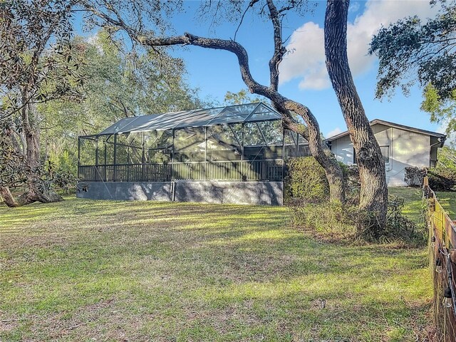 view of yard featuring a lanai