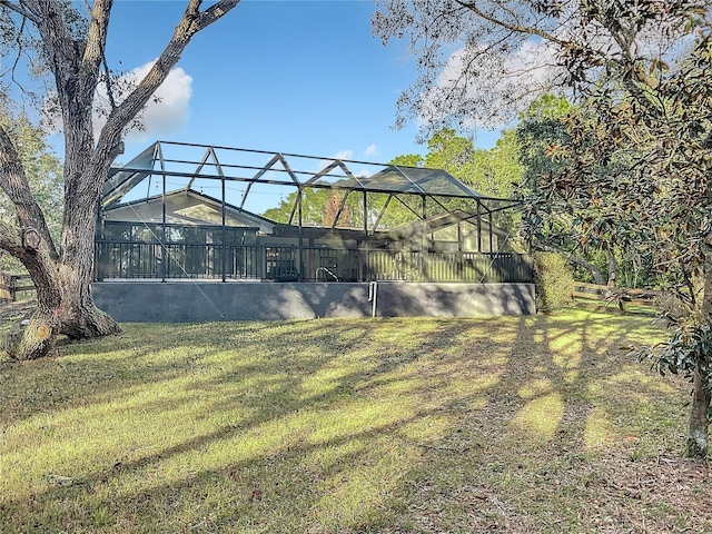 view of yard with glass enclosure