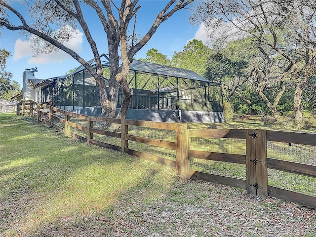 view of yard with glass enclosure