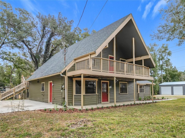 view of front of home with a patio area and a front yard