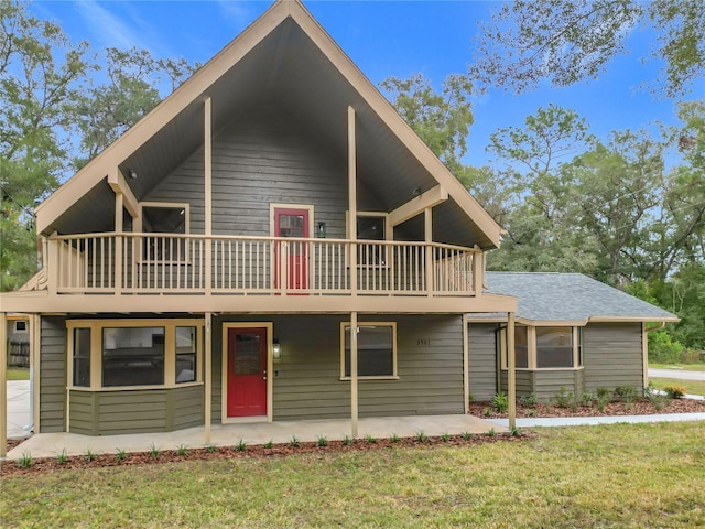 view of front of home with a front lawn and a patio