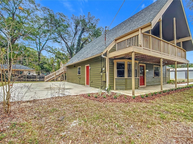 view of side of home with a patio area