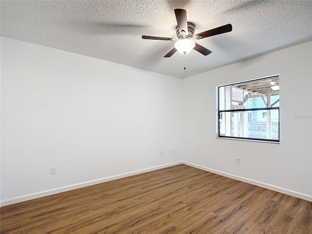 unfurnished room with hardwood / wood-style floors, ceiling fan, and a textured ceiling