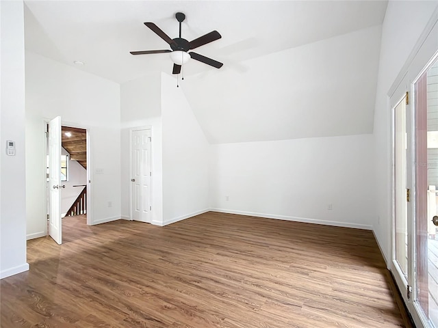 additional living space with hardwood / wood-style floors, ceiling fan, and lofted ceiling