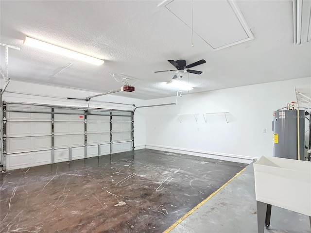 garage with sink, a garage door opener, ceiling fan, and water heater