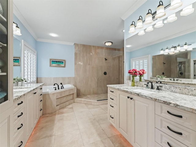 bathroom with tile patterned flooring, vanity, separate shower and tub, and ornamental molding