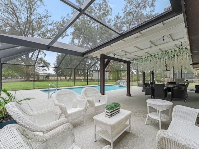 view of pool with a lanai and a patio area