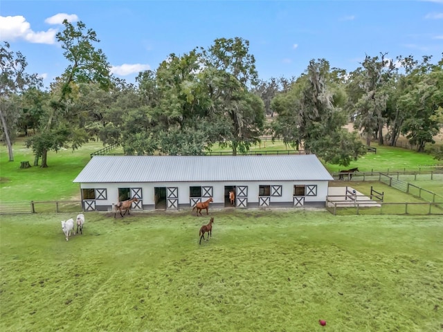 exterior space featuring an outbuilding and a rural view