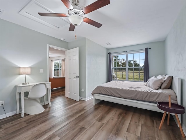 bedroom featuring hardwood / wood-style flooring and ceiling fan