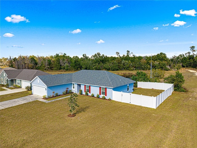 view of front facade featuring a front lawn and a garage