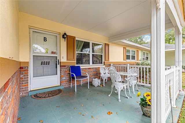 doorway to property with a porch