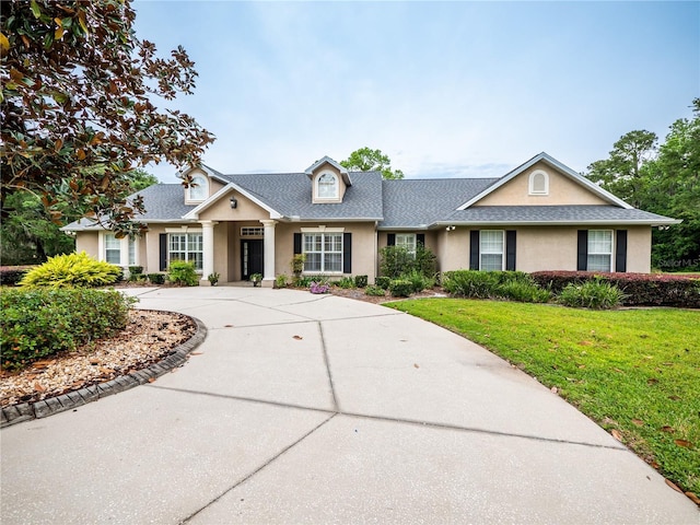 view of front of property with a front lawn