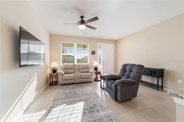 living room featuring ceiling fan and light tile patterned flooring