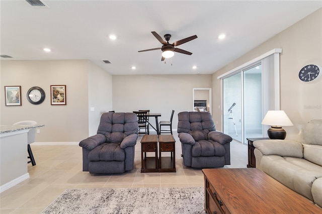 living room with ceiling fan and light tile patterned floors