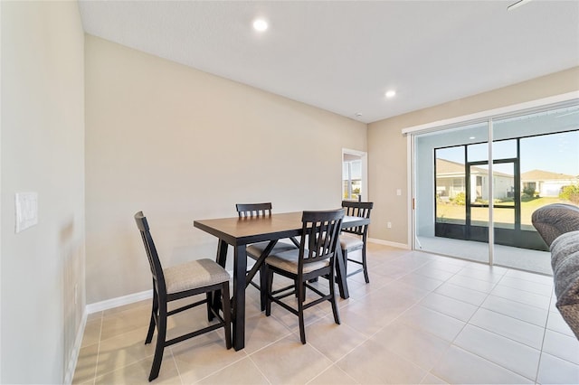 dining area with light tile patterned floors