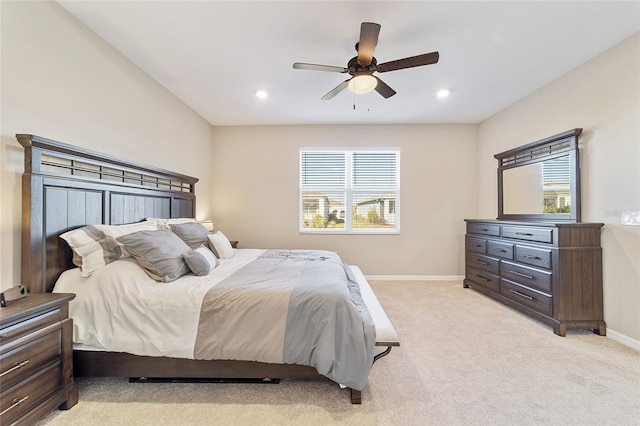 carpeted bedroom with multiple windows and ceiling fan