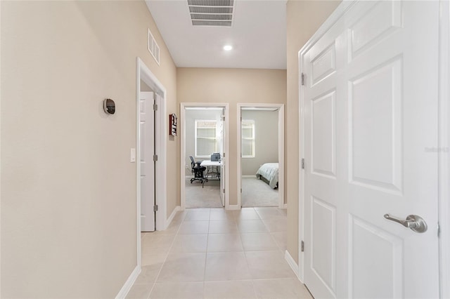 hallway with light tile patterned floors