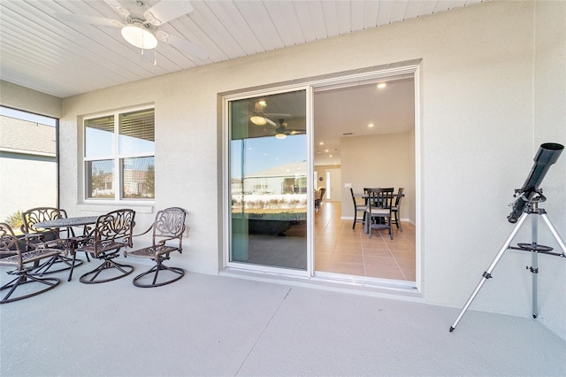 exterior space with ceiling fan and plenty of natural light