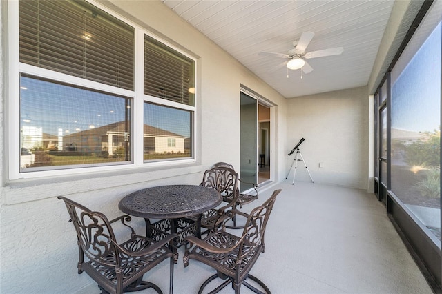 sunroom featuring ceiling fan